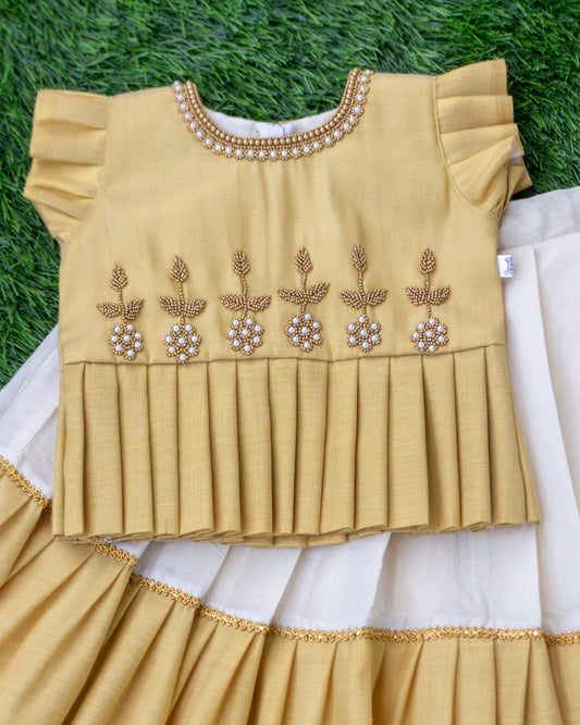 Golden Kasavu handwork detailing on cream gold Onam lehenga choli – Stanwells Kids