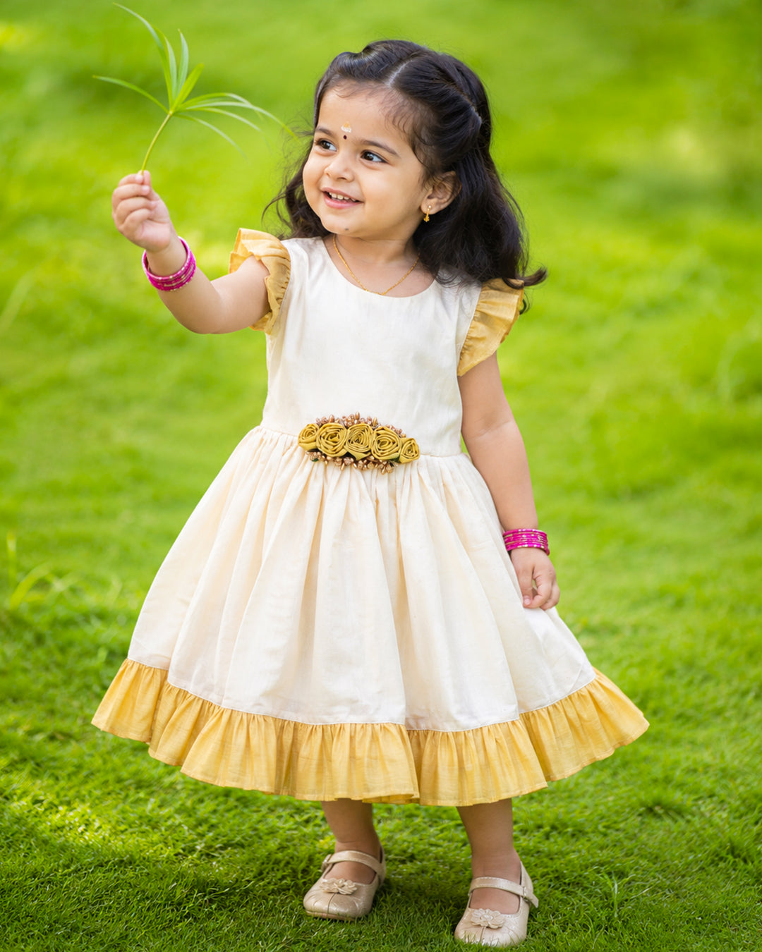 Cream and gold tissue Kerala handloom flower frock for baby girl – front view, Stanwells Kids