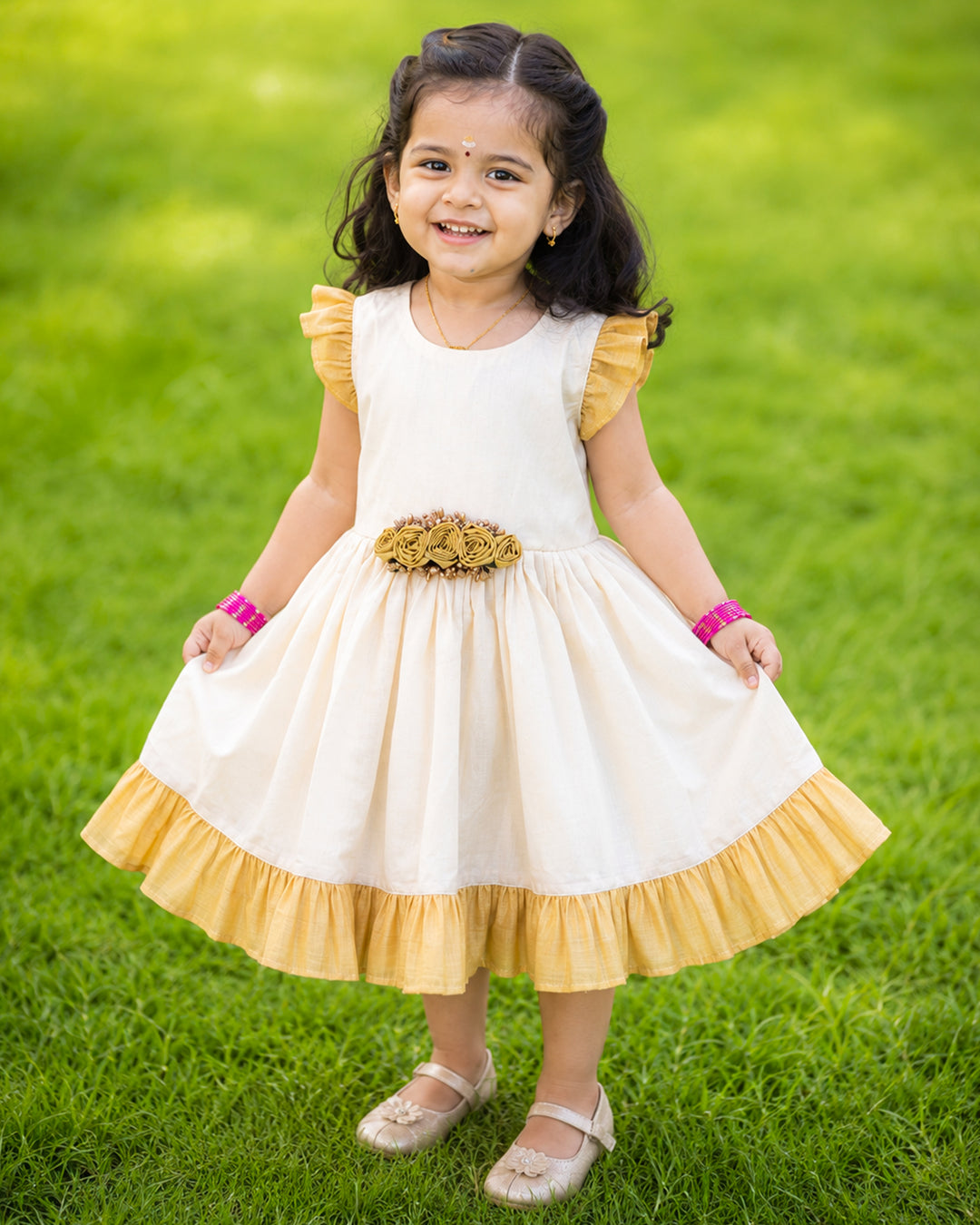 Cream and gold tissue Kerala handloom flower frock for baby girl – front view, Stanwells Kids