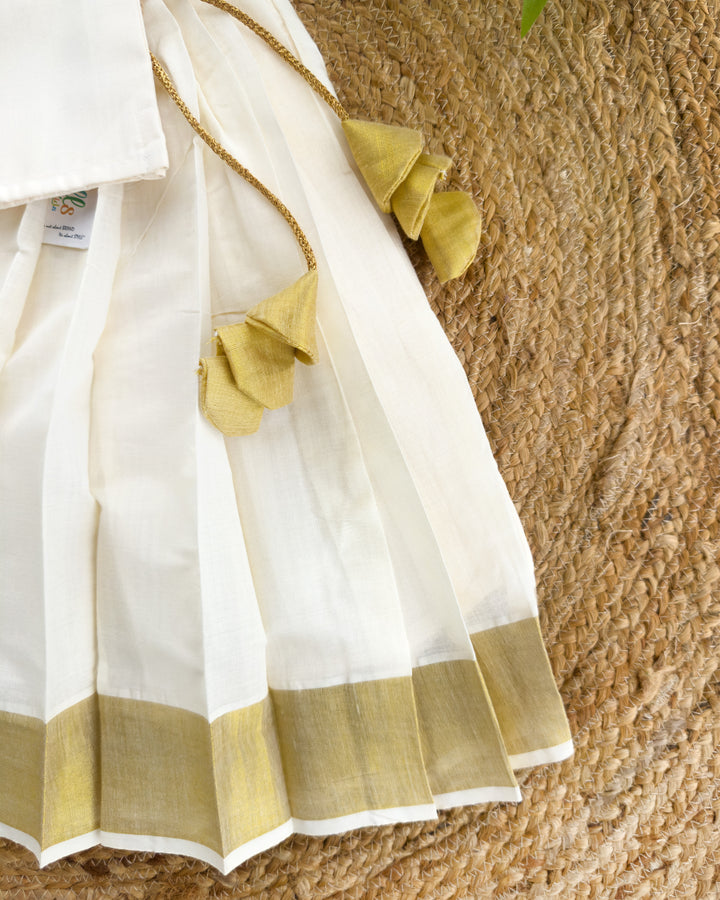 Golden Kasavu pleated lehenga skirt with cream flower blouse – Stanwells Kids