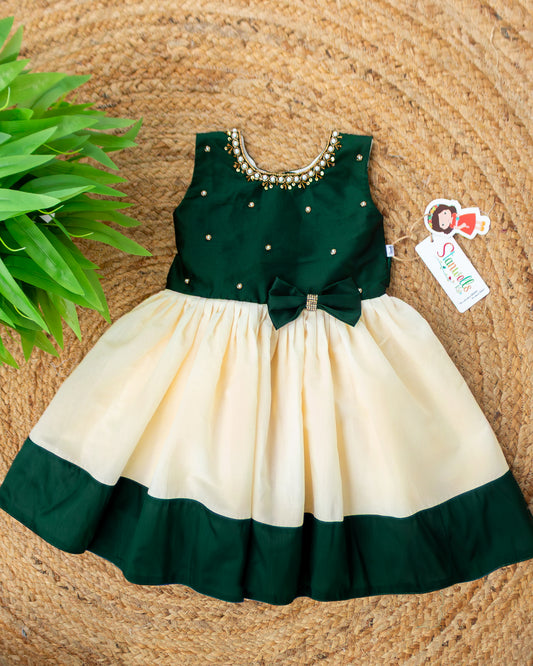 Cream and green Kerala Onam traditional handloom frock for baby girl – front view, Stanwells Kids