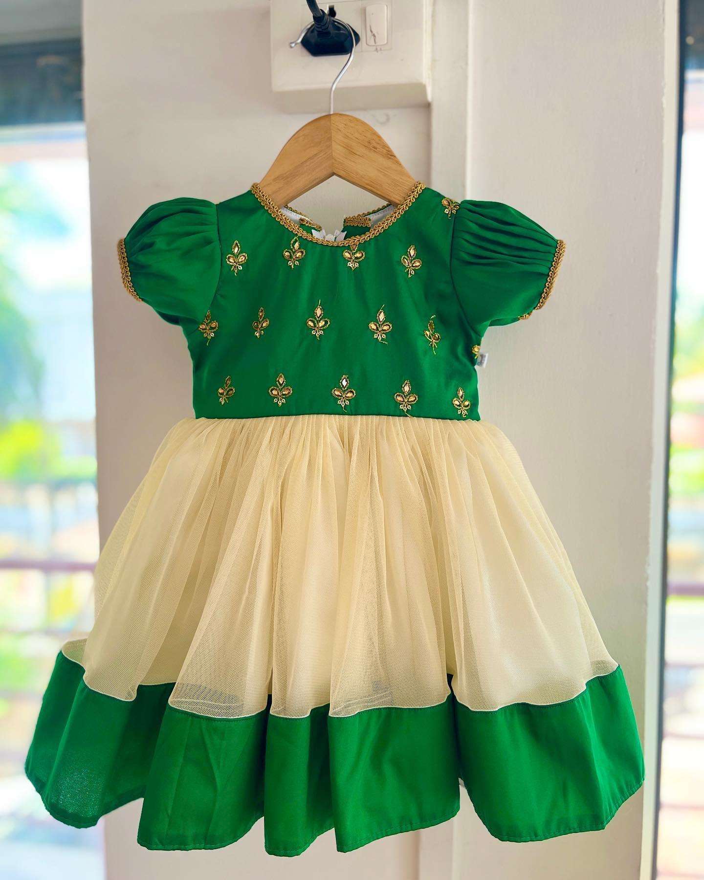 Cream & Green Traditional Embroidery Stone work Frock
Material: Green Taffetta silk top with golden embroidery stone work, Cream soft net skirt with matching border. Beautifully designed outfit for baby girls with smoo