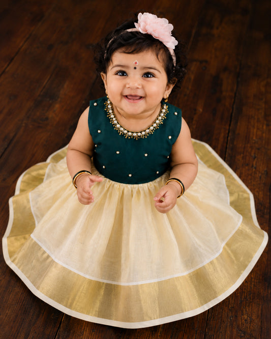 Cream and green handwork Onam traditional frock for baby girl – front view, Stanwells Kids