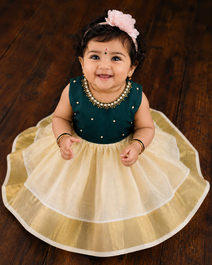 Cream and green handwork Onam traditional frock for baby girl – front view, Stanwells Kids