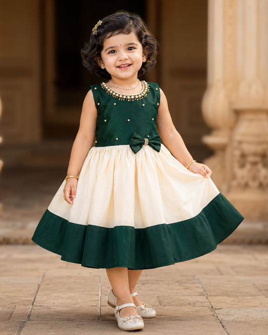 Cream and green Kerala Onam traditional handloom frock for baby girl – front view, Stanwells Kids