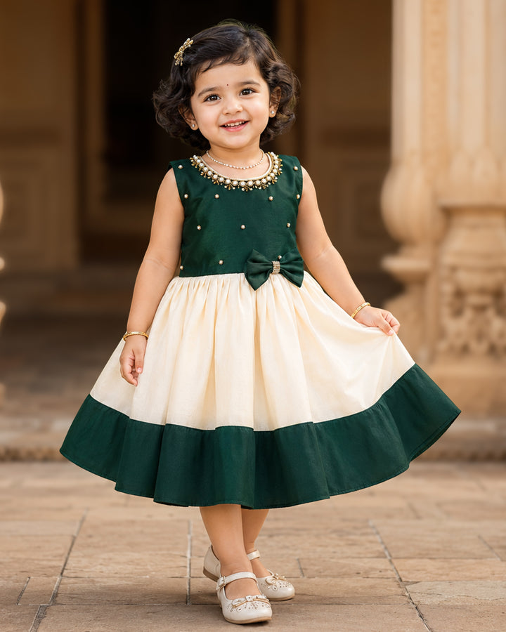 Cream and green Kerala Onam traditional handloom frock for baby girl – front view, Stanwells Kids