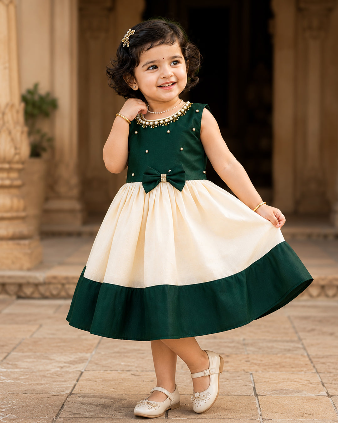 Cream and green Kerala Onam traditional handloom frock for baby girl – front view, Stanwells Kids