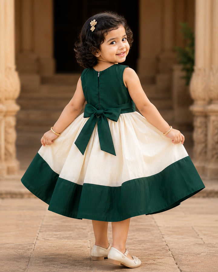 Cream and green Kerala Onam traditional handloom frock for baby girl – front view, Stanwells Kids