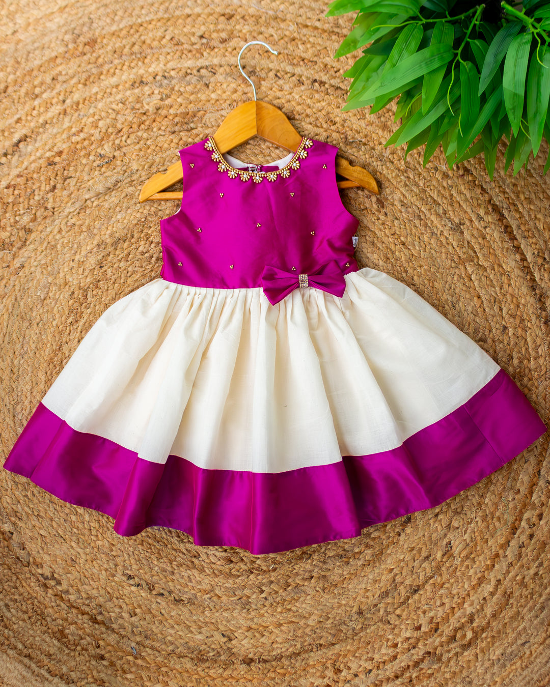 Cream and magenta Kerala handloom Onam special frock for baby girl – front view, Stanwells Kids