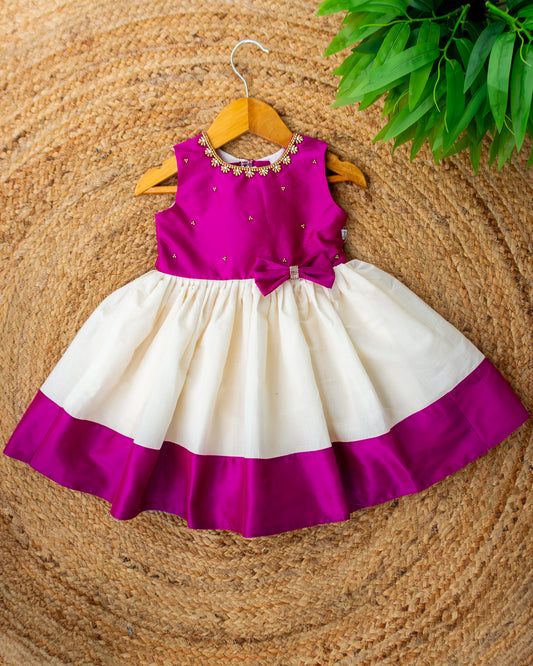 Cream and magenta Kerala handloom Onam special frock for baby girl – front view, Stanwells Kids