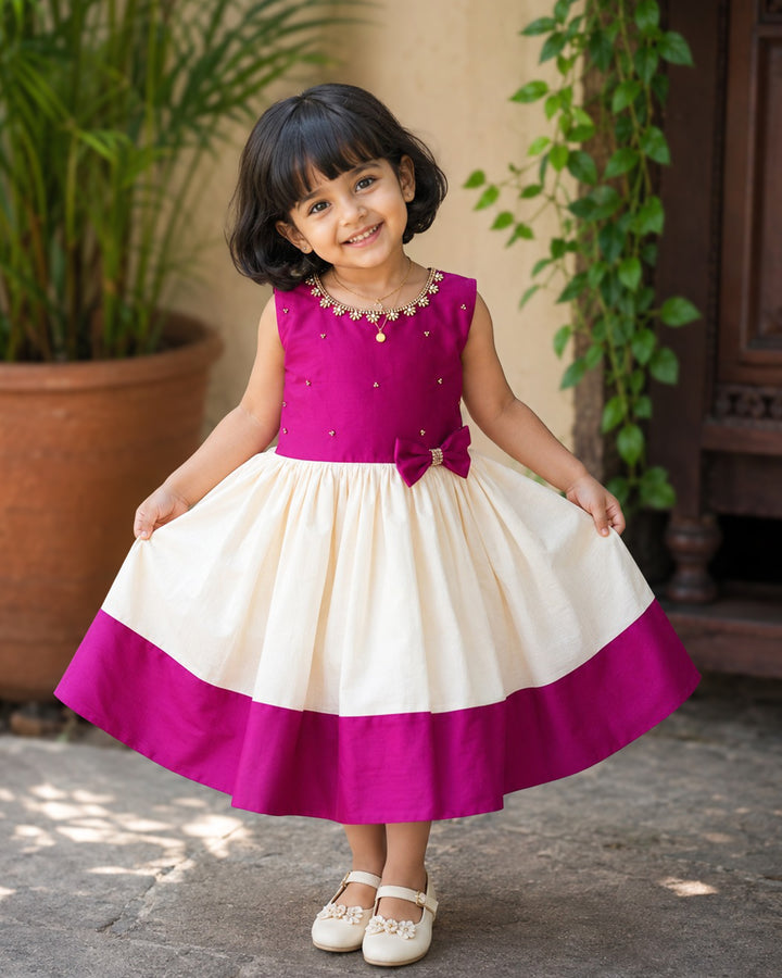 Cream and magenta Kerala handloom Onam special frock for baby girl – front view, Stanwells Kids