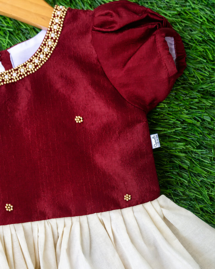 Elegant cream maroon Kerala ethnic frock for baby girl with handcrafted embroidery, stanwells kids

