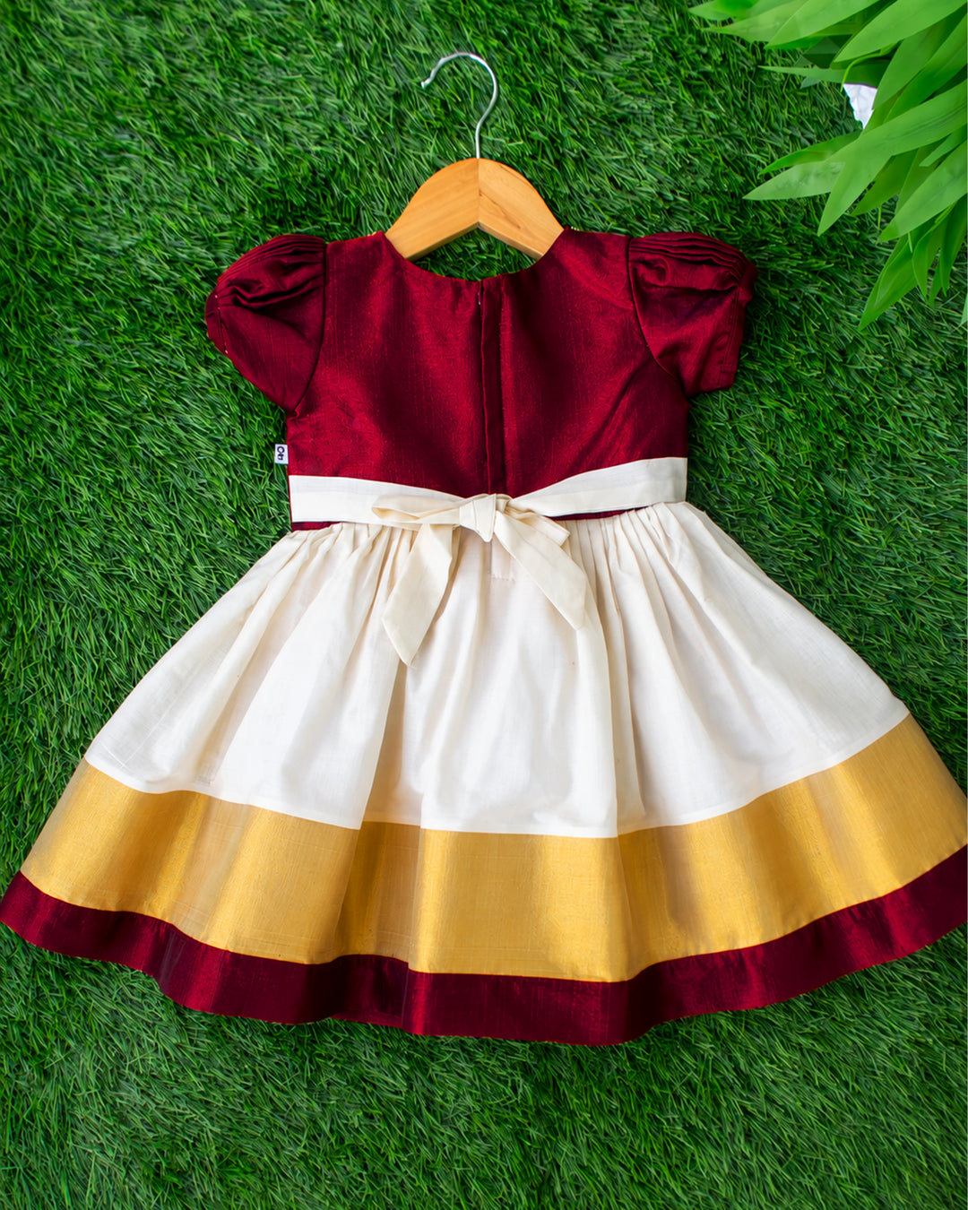 Back view of cream maroon Kerala handloom frock with zipper for baby girls, stanwells kids