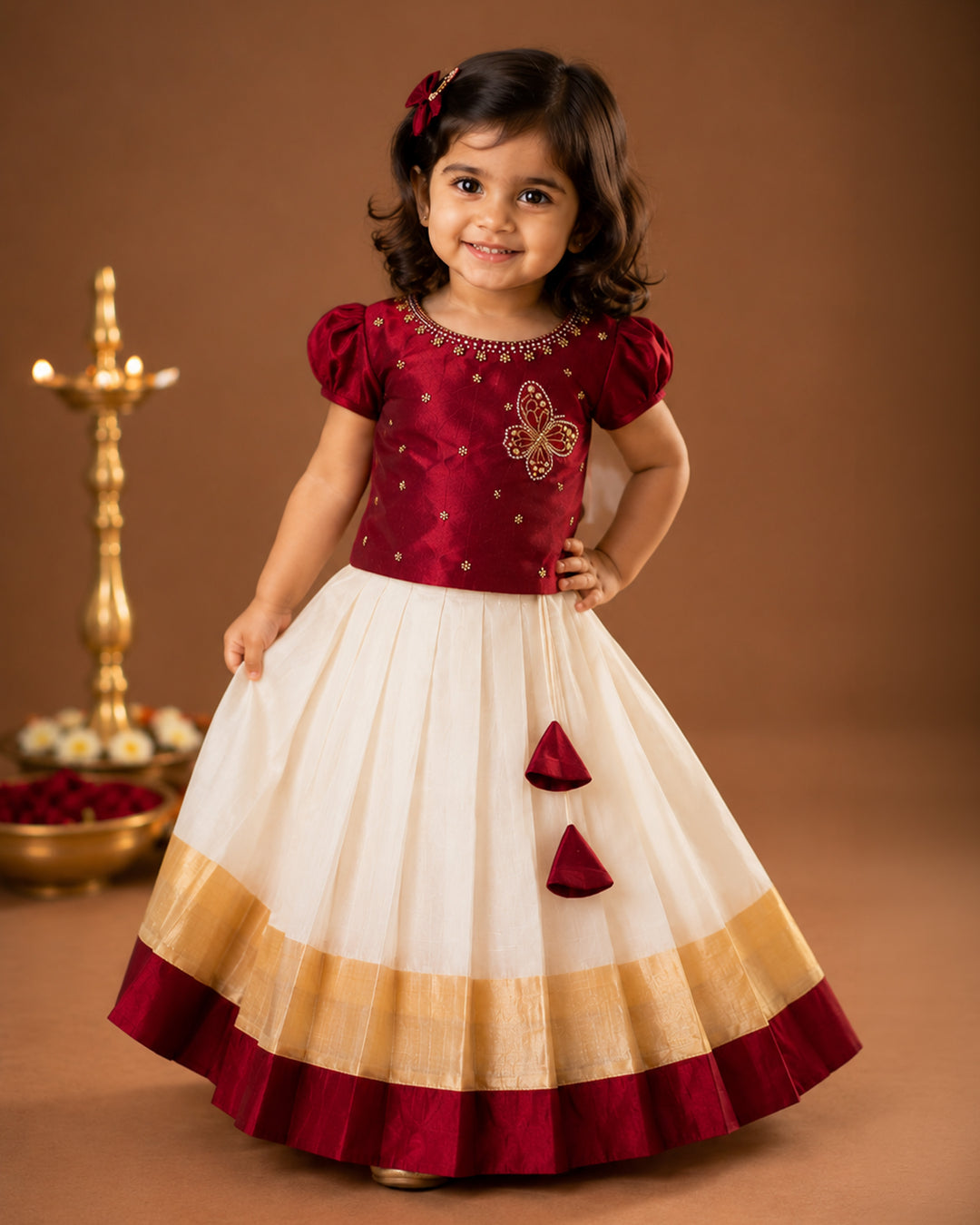 First Onam baby girl wearing cream maroon butterfly Kasavu lehenga, Stanwells Kids