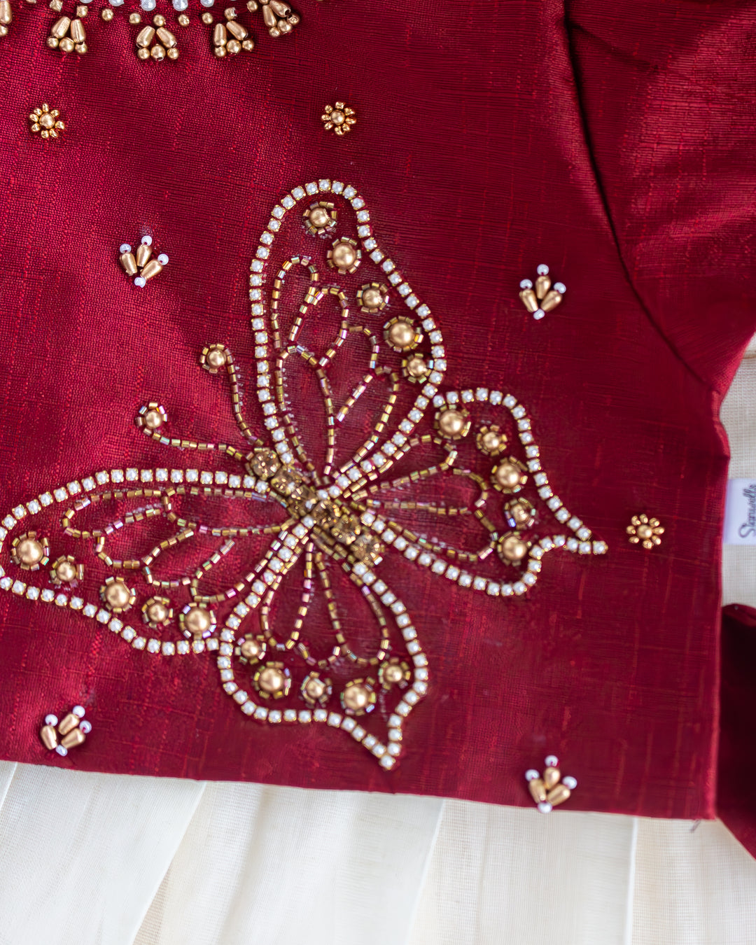 Maroon taffeta and Kerala tissue silk lehenga for Onam, Stanwells Kids