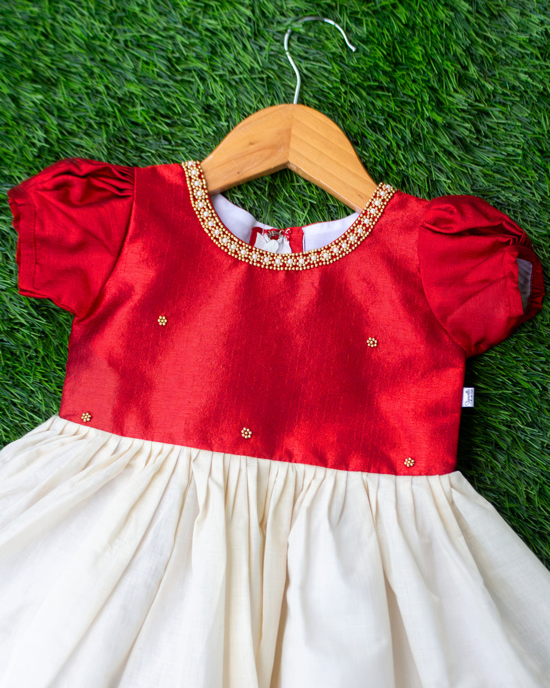 Golden bead neck detail on cream maroon Kerala handloom traditional frock – Stanwells Kids