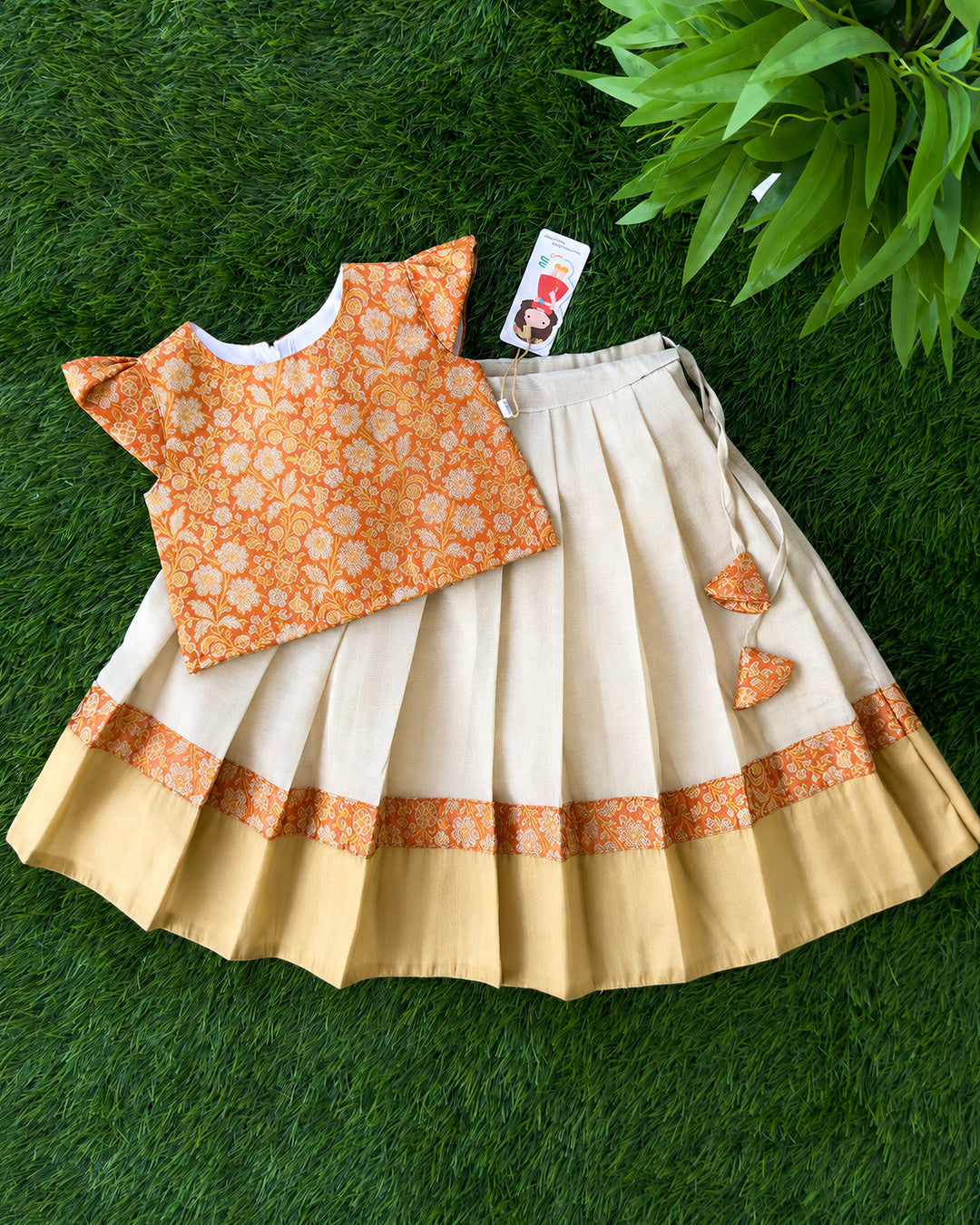 Cream and orange Banarasi brocade lehenga choli for baby girl – front view, Stanwells Kids