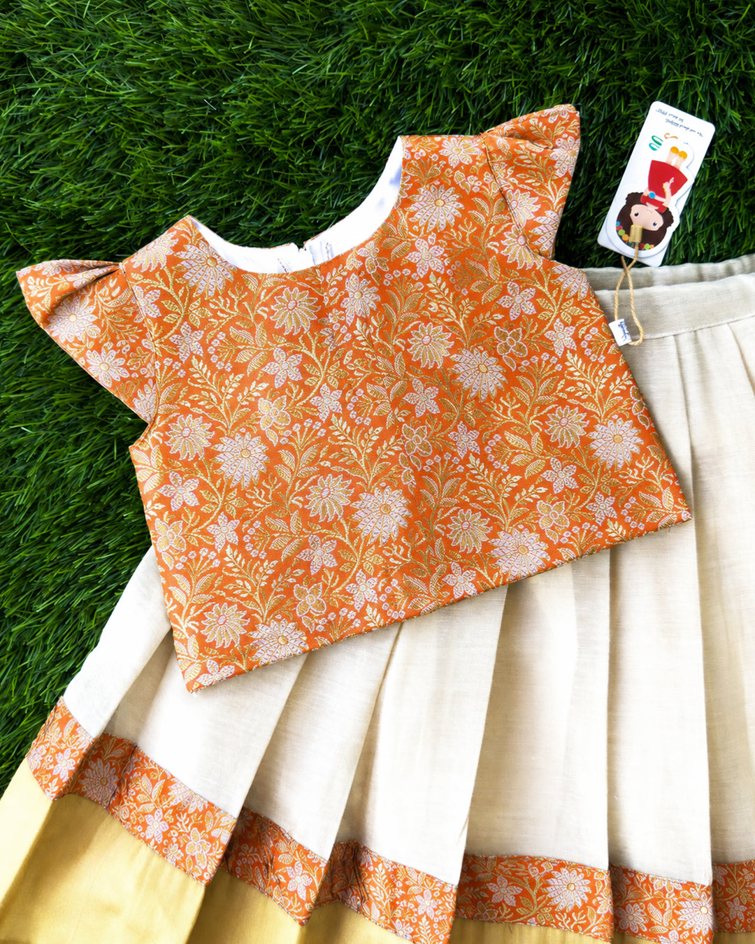 Rich golden detailing on cream orange Banarasi brocade lehenga choli – Stanwells Kids