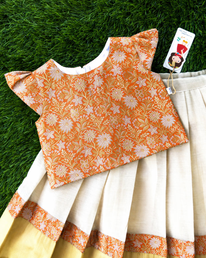Rich golden detailing on cream orange Banarasi brocade lehenga choli – Stanwells Kids