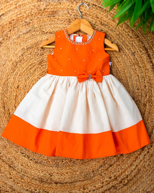 Cream and orange Onam festive Kerala traditional frock for baby girl – front view, Stanwells Kids