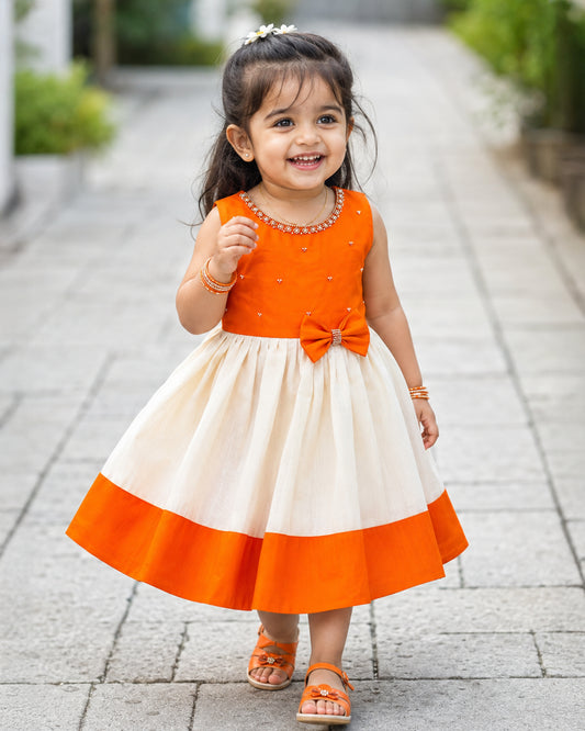 Cream and orange Onam festive Kerala traditional frock for baby girl – front view, Stanwells Kids