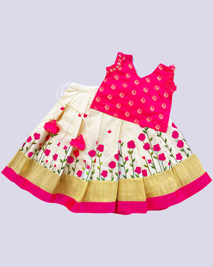 Cream and pink embroidered cotton lehenga for baby girls' birthdays.