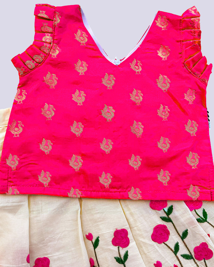 Cream and pink embroidered cotton lehenga for baby girls' birthdays.