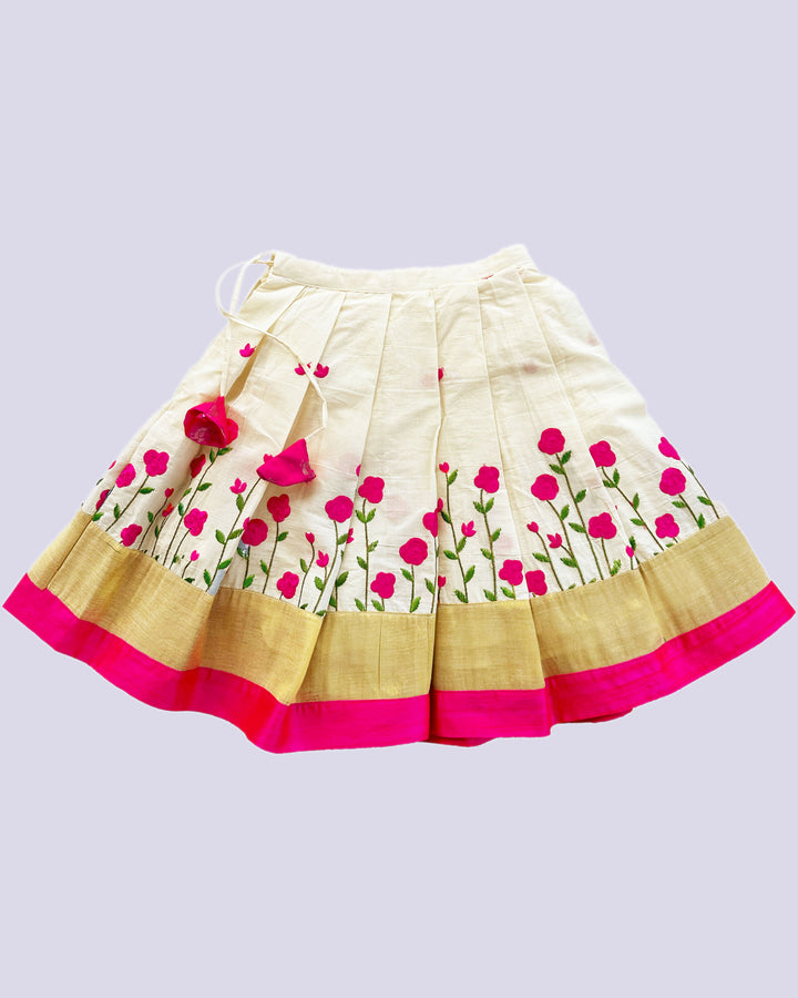 Cream and pink embroidered cotton lehenga for baby girls' birthdays.