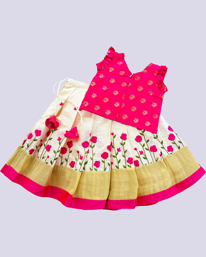 Cream and pink embroidered cotton lehenga for baby girls' birthdays.