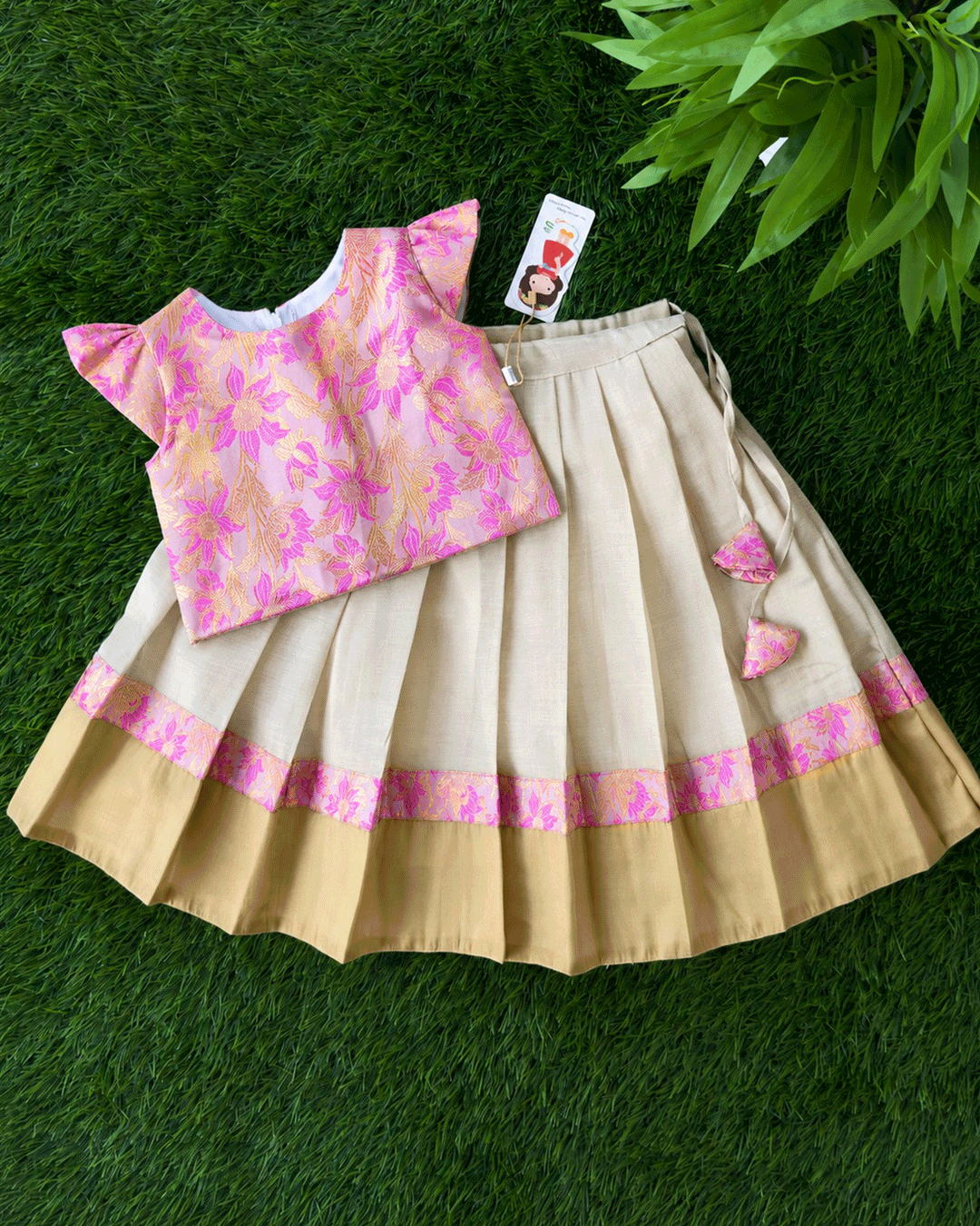 Cream and pink tissue gold pure Banarasi brocade Onam traditional lehenga for baby girl – front view, Stanwells Kids