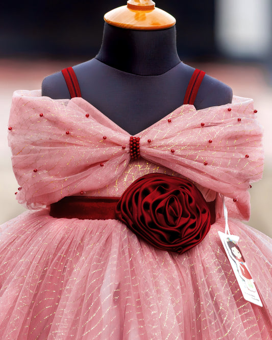 Dust pink baby girl frock gown with burgundy rose, layered ruffle bow and embellished bodice detail, close-up view