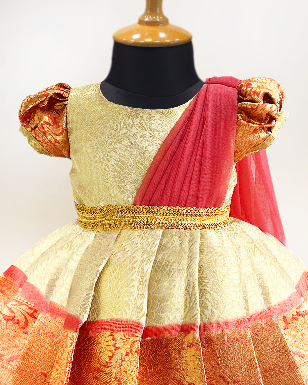 Gold and peach Banarasi silk saree frock for baby girls

Traditional puff sleeve dress for kids

Banarasi silk birthday dress for girls

Baby girls ethnic wear frock

Festive partywear for toddlers

Gold peach traditional frock for baby girls

Stanwells Kids birthday collection