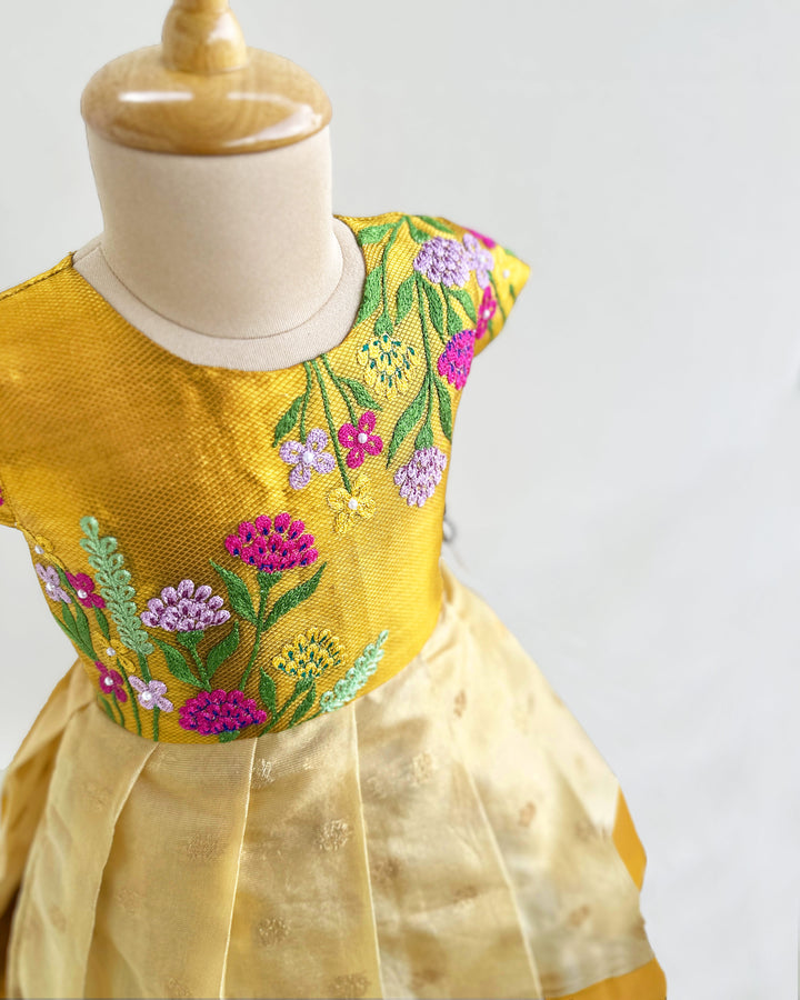 Golden silk birthday dress for baby girls with floral embroidery – Onam special frock


