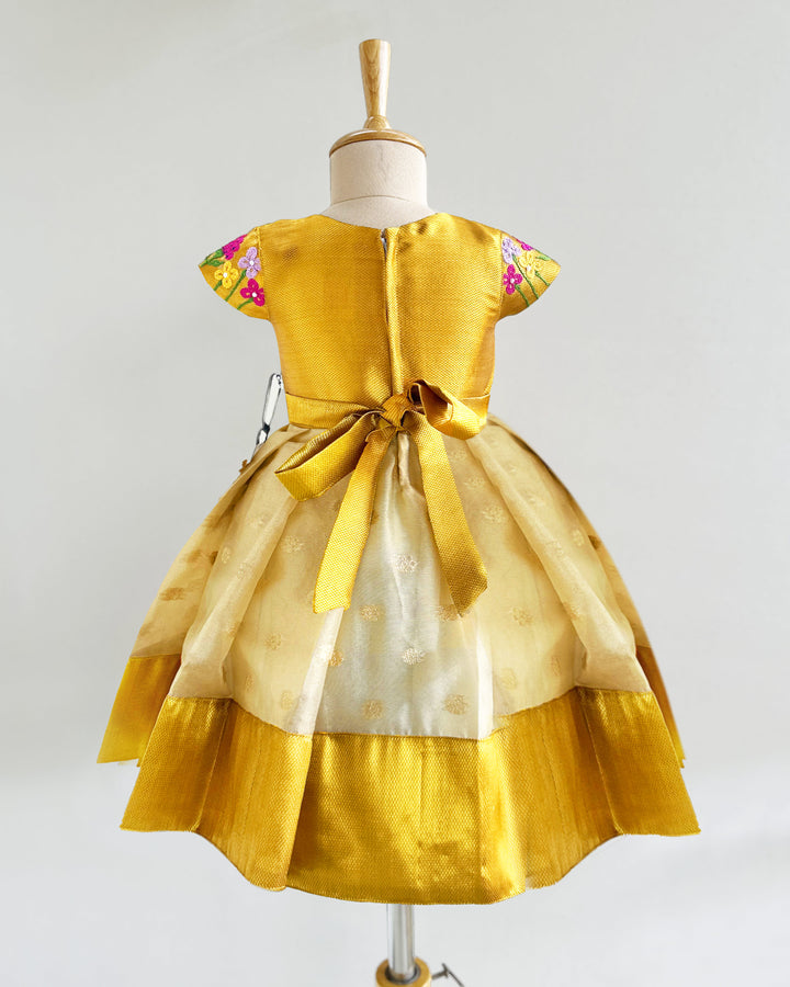 Golden silk birthday dress for baby girls with floral embroidery – Onam special frock


