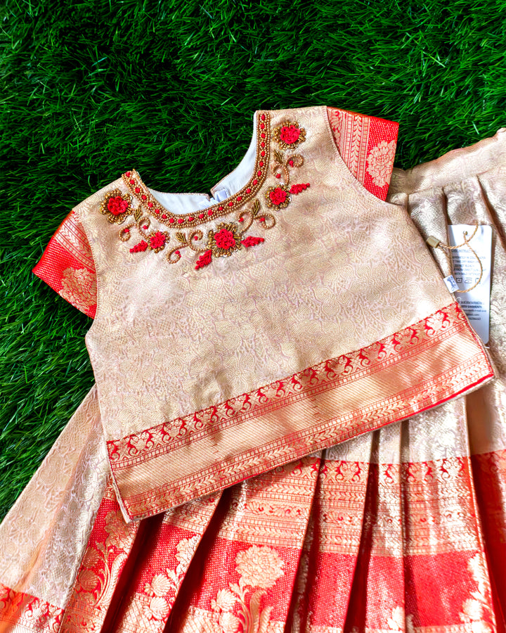Golden handwork detail on red Banarasi silk lehenga blouse – Stanwells Kids