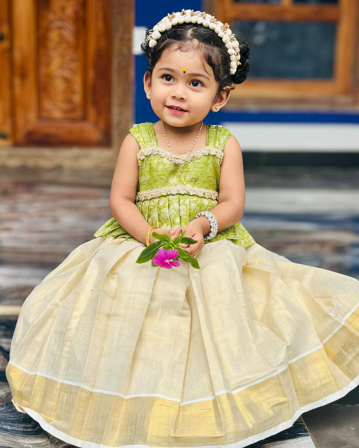 Green Banarasi brocade Kerala traditional lehenga choli for baby girl – front view, Stanwells Kids