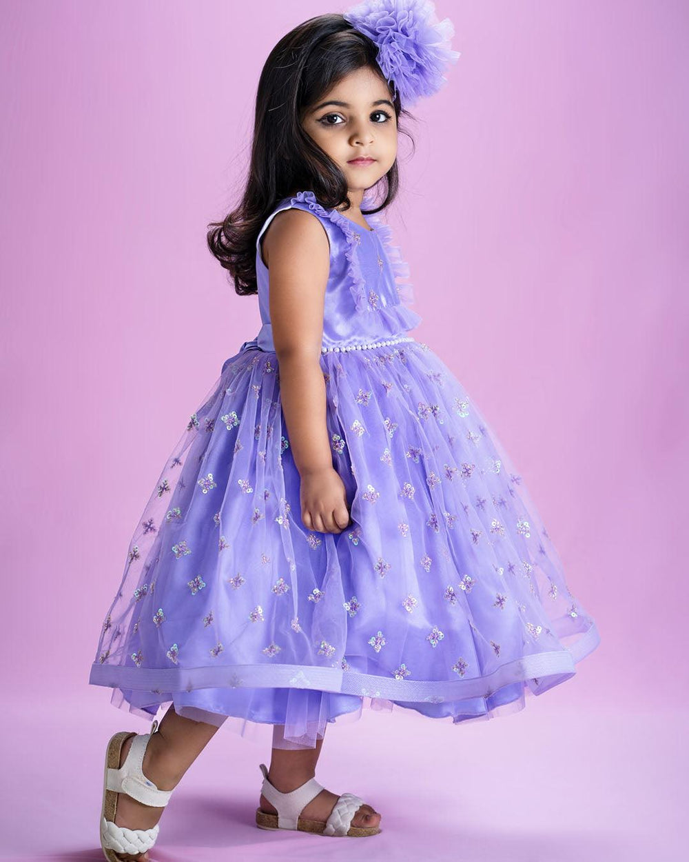 Lavender Shade Sequins Embroidery Ruffles Flarred Partywear Frock
Material: Lavender shade mono nylon sequins embroidery soft net fabric is used for the bottom of the skirt. Yoke portion is designed with same colour with ruffles o