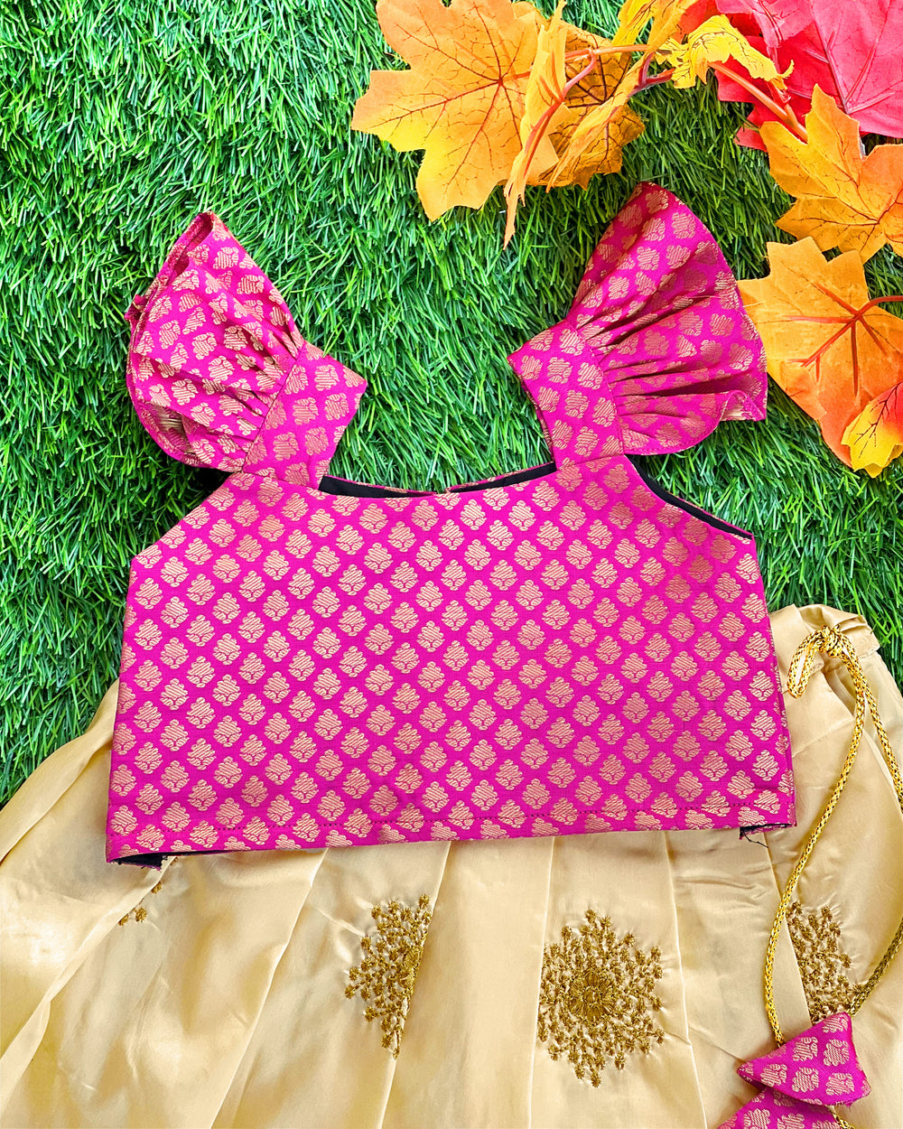 Baby girl in cream and magenta lehenga choli birthday and festive dress