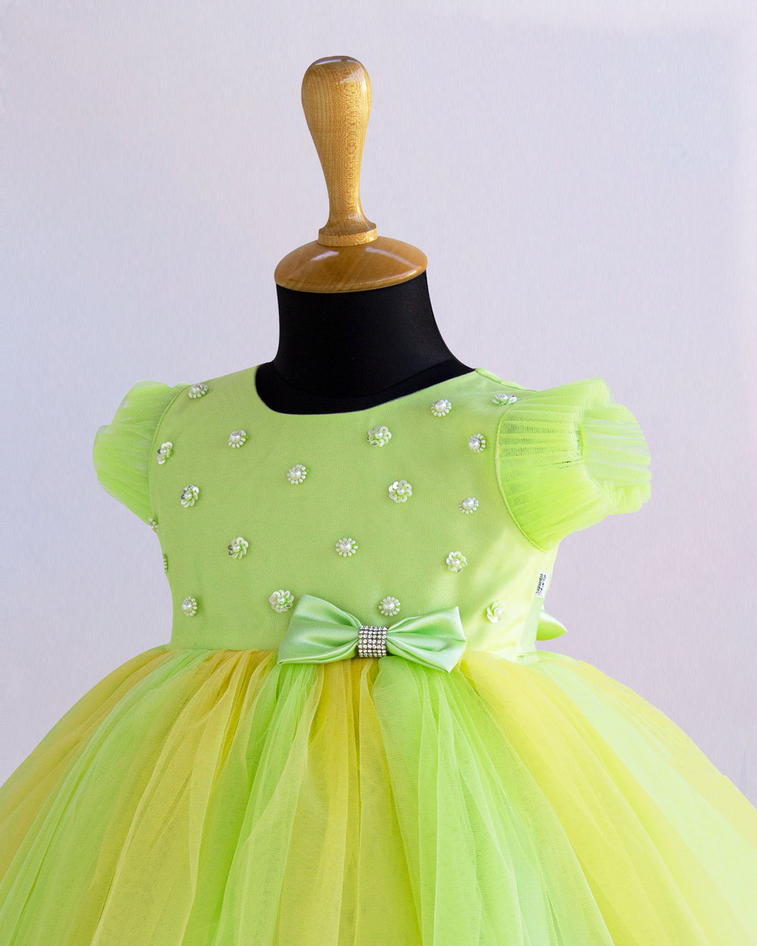 Light green and baby yellow birthday frock for baby girls

Partywear dress for girls 6M–8Y

Stylish dual-color frock for toddlers

Elegant baby girls birthday outfit

Festive wear frock for kids

Stanwells Kids yellow green party dress

Designer birthday frock for baby girls
