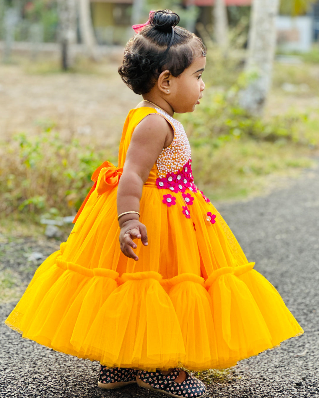 Mango Yellow & Magenta combo Handwork Flower Frock
Material: Mango yellow colour net is used to make this elegant dress. Magenta colour satin flowers are spreaded on one side of the frock. Another side of the frock 