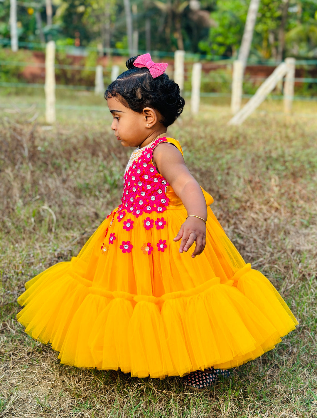 Mango Yellow & Magenta combo Handwork Flower Frock
Material: Mango yellow colour net is used to make this elegant dress. Magenta colour satin flowers are spreaded on one side of the frock. Another side of the frock 