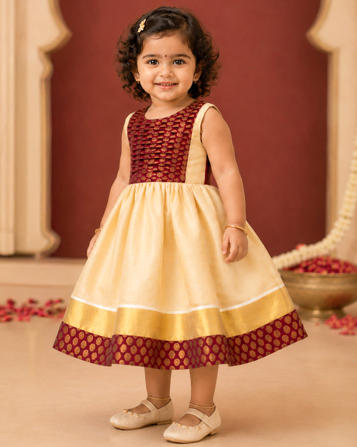Golden base with maroon accents on Onam tissue frock for girls – Stanwells Kids