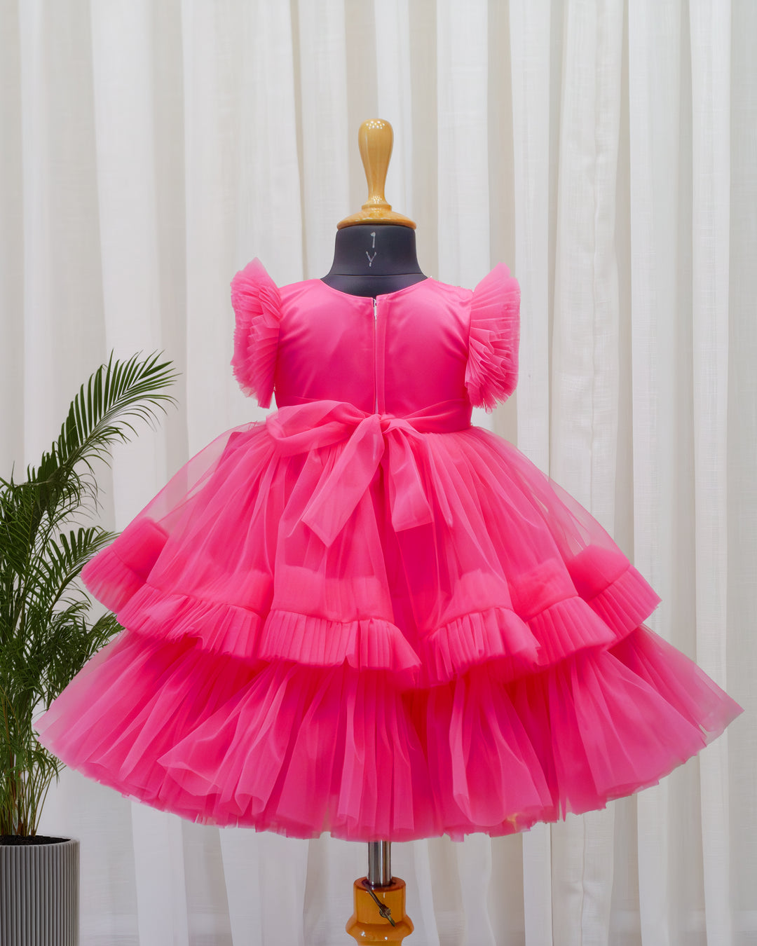Back view of peach mermaid party frock with satin tie – Stanwells Kids