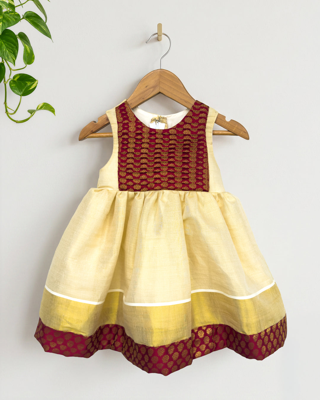 Maroon brocade Onam special tissue frock for baby girl – front view, Stanwells Kids