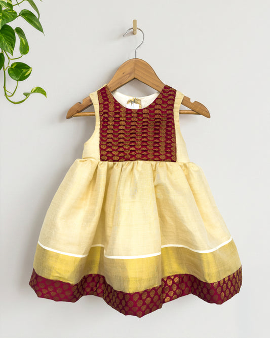 Maroon brocade Onam special tissue frock for baby girl – front view, Stanwells Kids