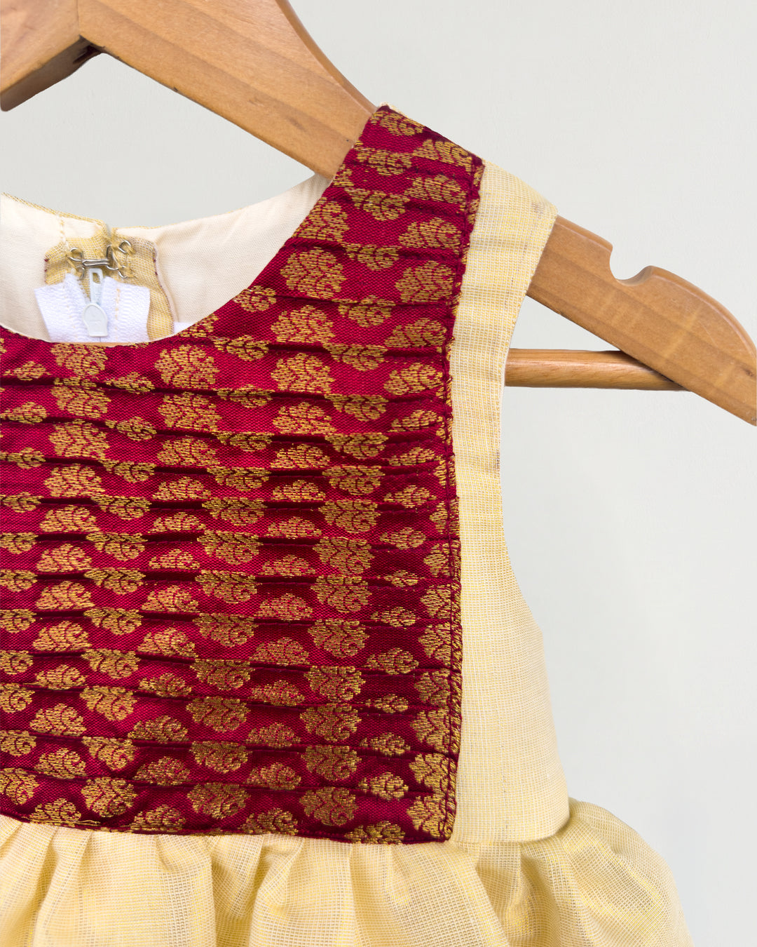 Golden base with maroon accents on Onam tissue frock for girls – Stanwells Kids