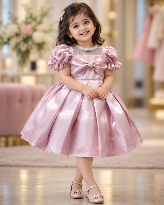 Metallic pink glossy satin flared partywear bow frock for baby girl – front view, Stanwells Kids