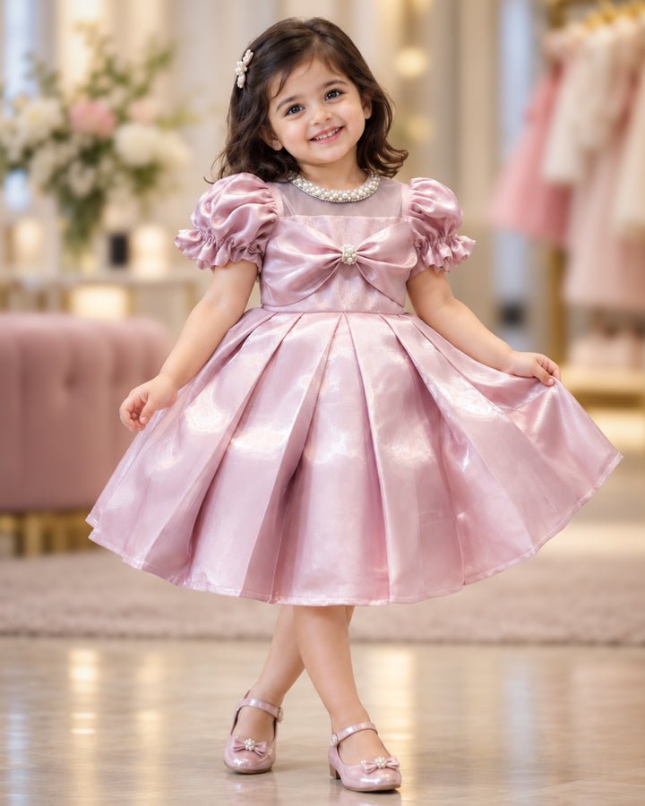 Metallic pink glossy satin flared partywear bow frock for baby girl – front view, Stanwells Kids
