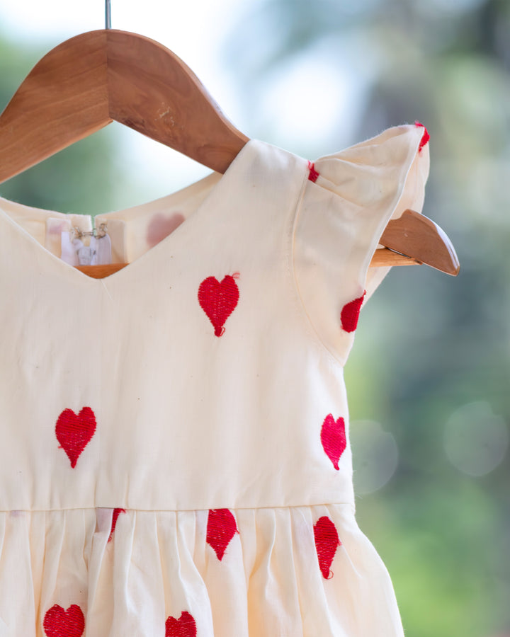 baby girls off white birthday dress

cotton birthday dress for baby girls

heart embroidery baby girl partywear dress

baby girls birthday party dress India

off white baby girl frock for birthday