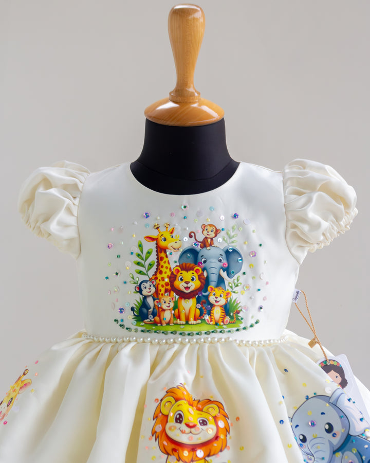 Jungle theme handwork detailing on off white silky satin partywear frock – Stanwells Kids